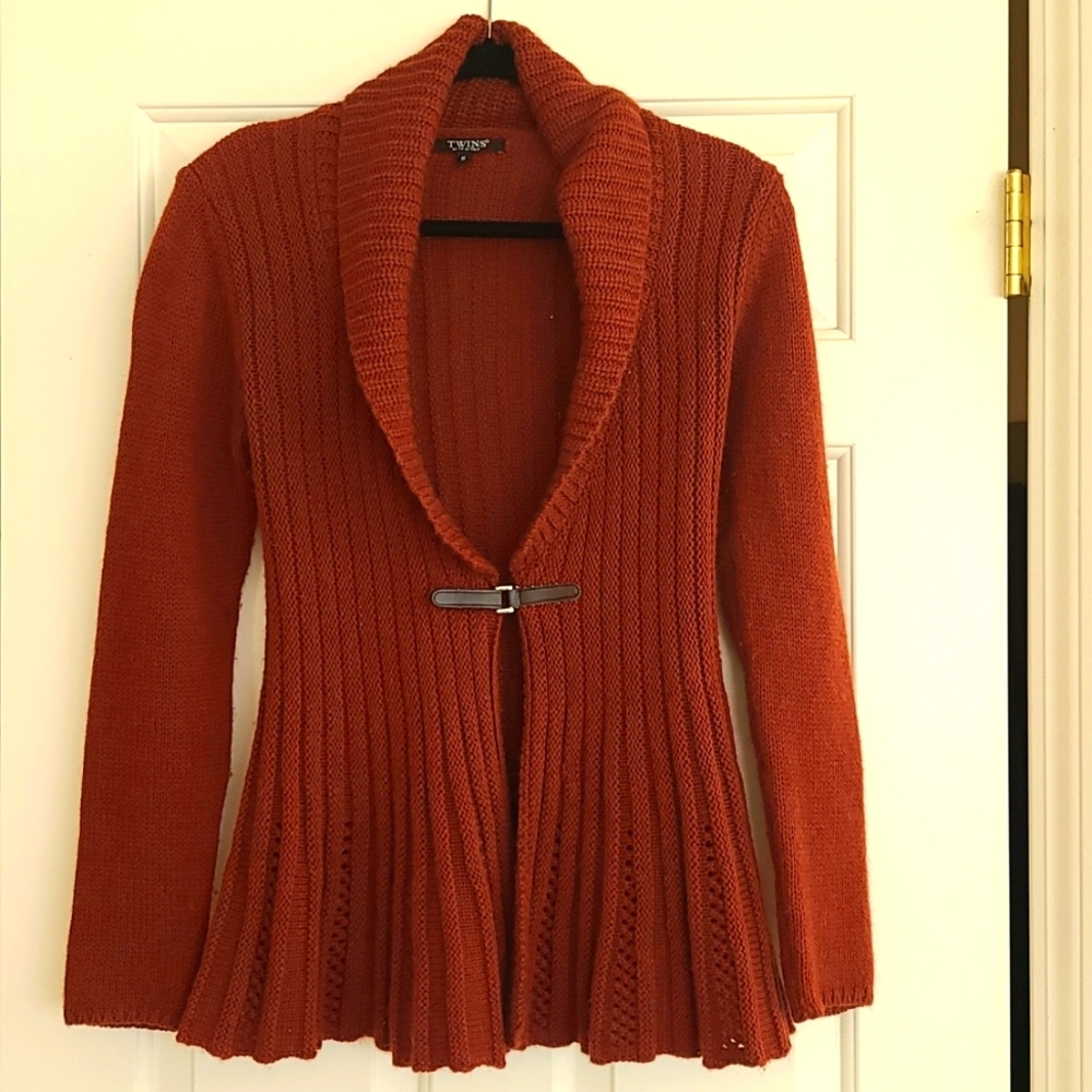 Rust colored long cardigan with flare.